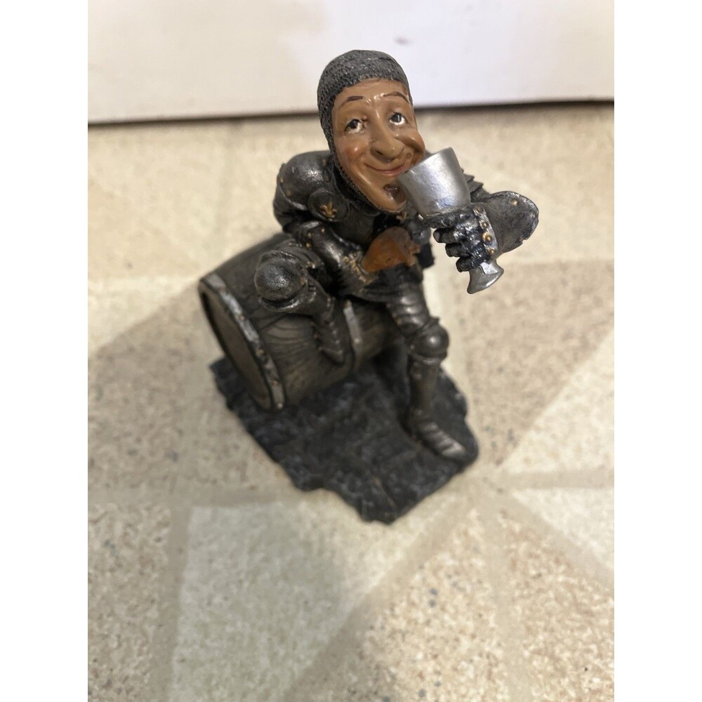 Vintage Medieval Styled Knight drinking on a barrel